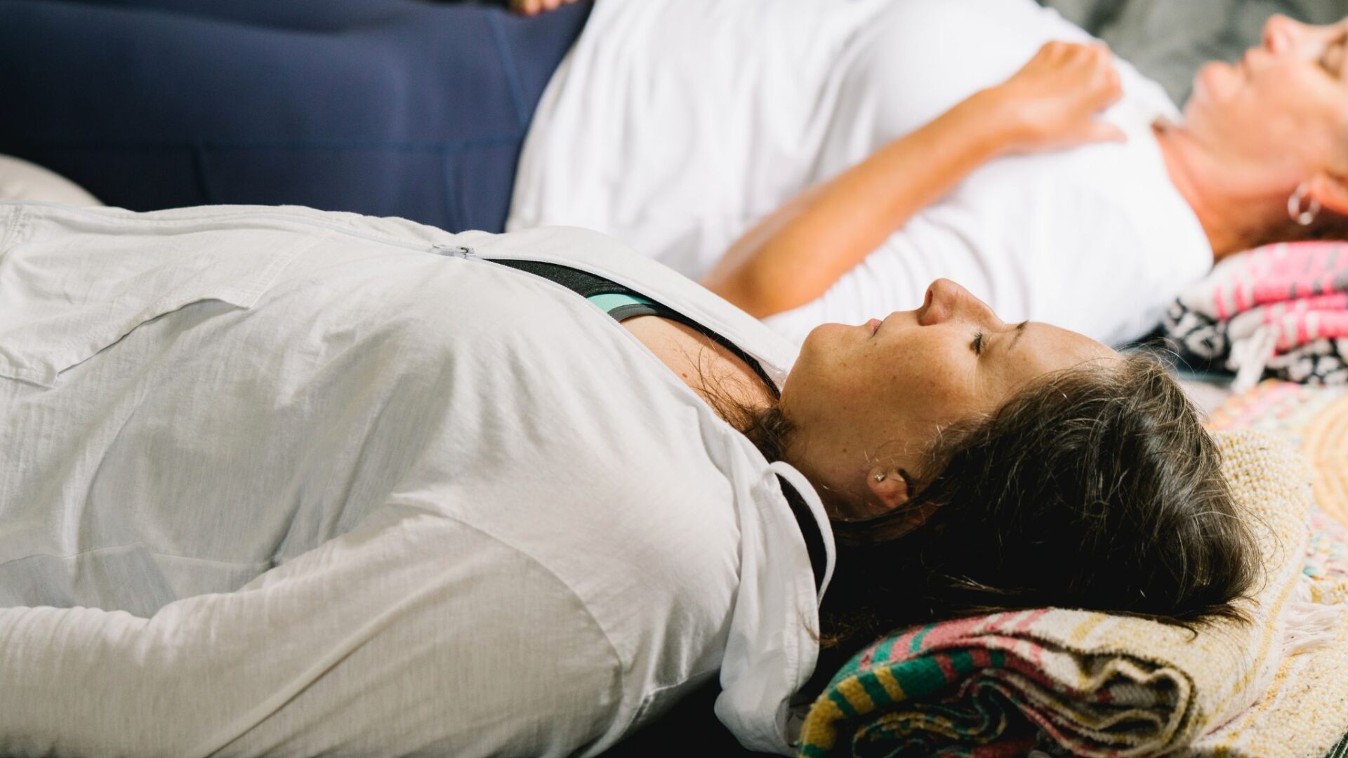 women practicing nature inspired yoga nidra during a yoga class
