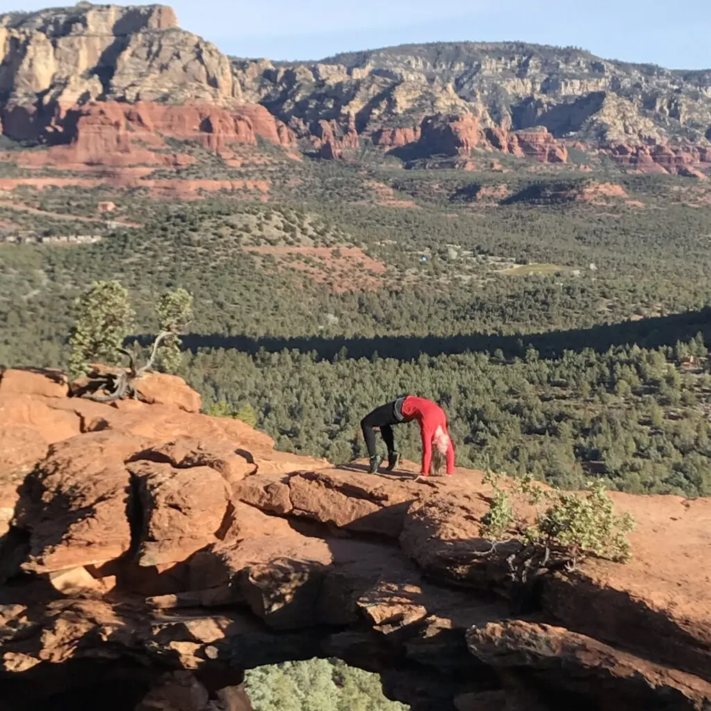 woman doing wheel pose on Devil's Bridge in Sedona