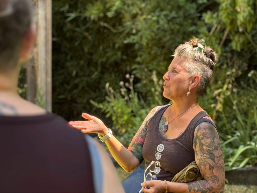 Lisa LeCuyer giving an herbalism talk at a women's retreat in Oregon