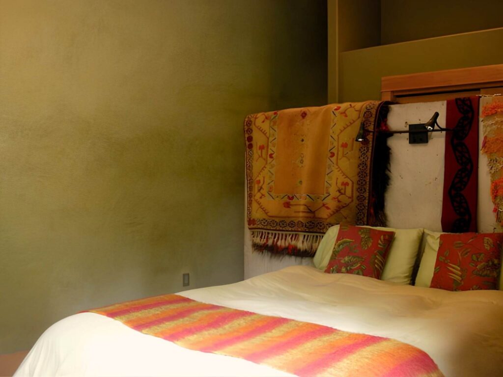master suite with king bed and private bathroom at yoga retreat in Oregon