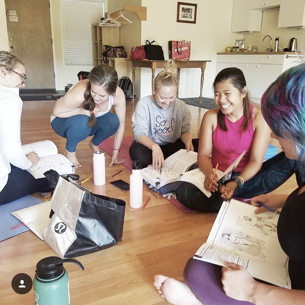 Autumn Adams reviewing anatomy work with yoga teacher trainees