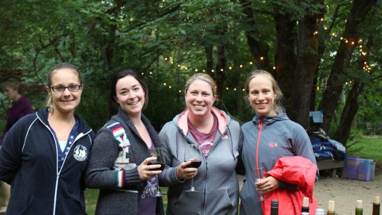 cozy, happy women during outdoor yoga retreat in Oregon