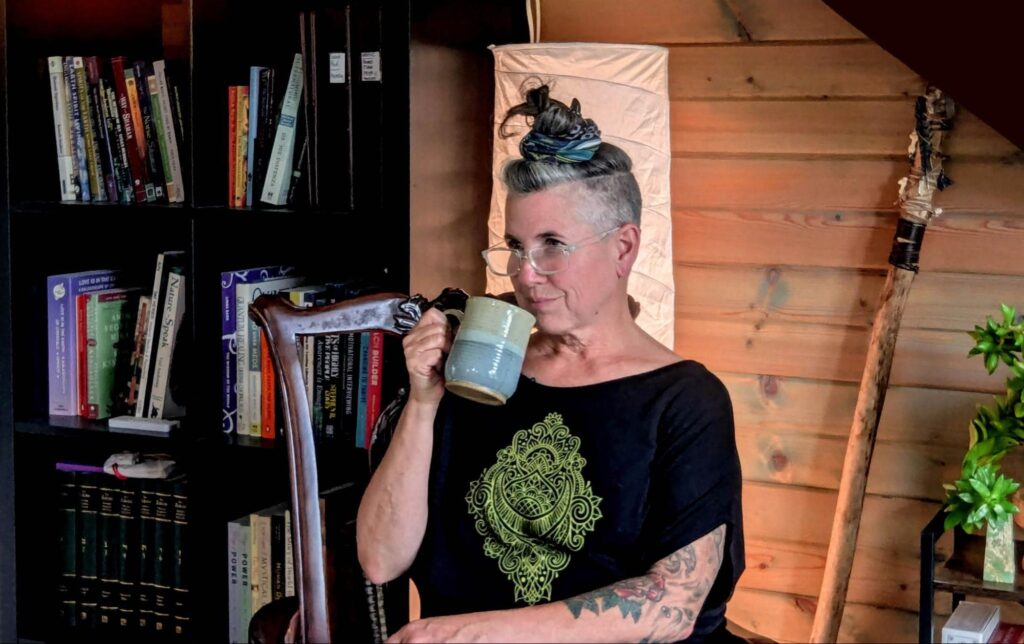 Herbalist Lisa LeCuyer drinking a calming nervous system tea