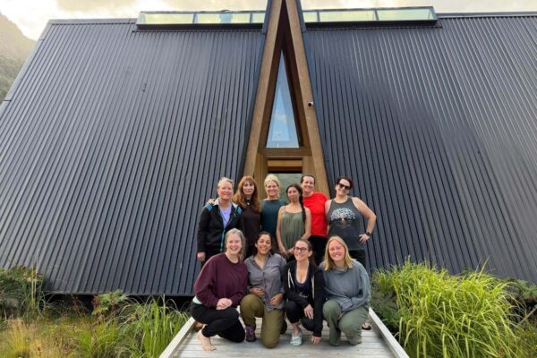 Yoga retreat group photo during yoga retreat in Patagonia at Tawa Refugio — afford a yoga retreat like this bucketlist offering