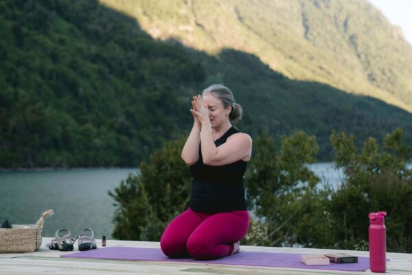 Autumn teaching an inner light meditation to reconnect with yourself on a yoga retreat