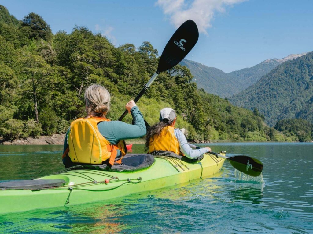 Kayaking on Puelo River during Patagonia yoga retreat