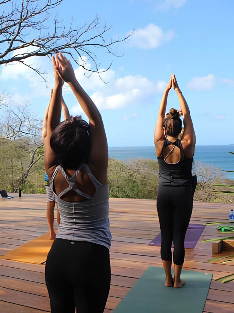 practicing yoga on an infinity deck overlooking the Pacific ocean near San Juan del Sur