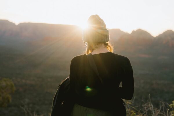 a quiet moment journaling at sunrise during a yoga retreat
